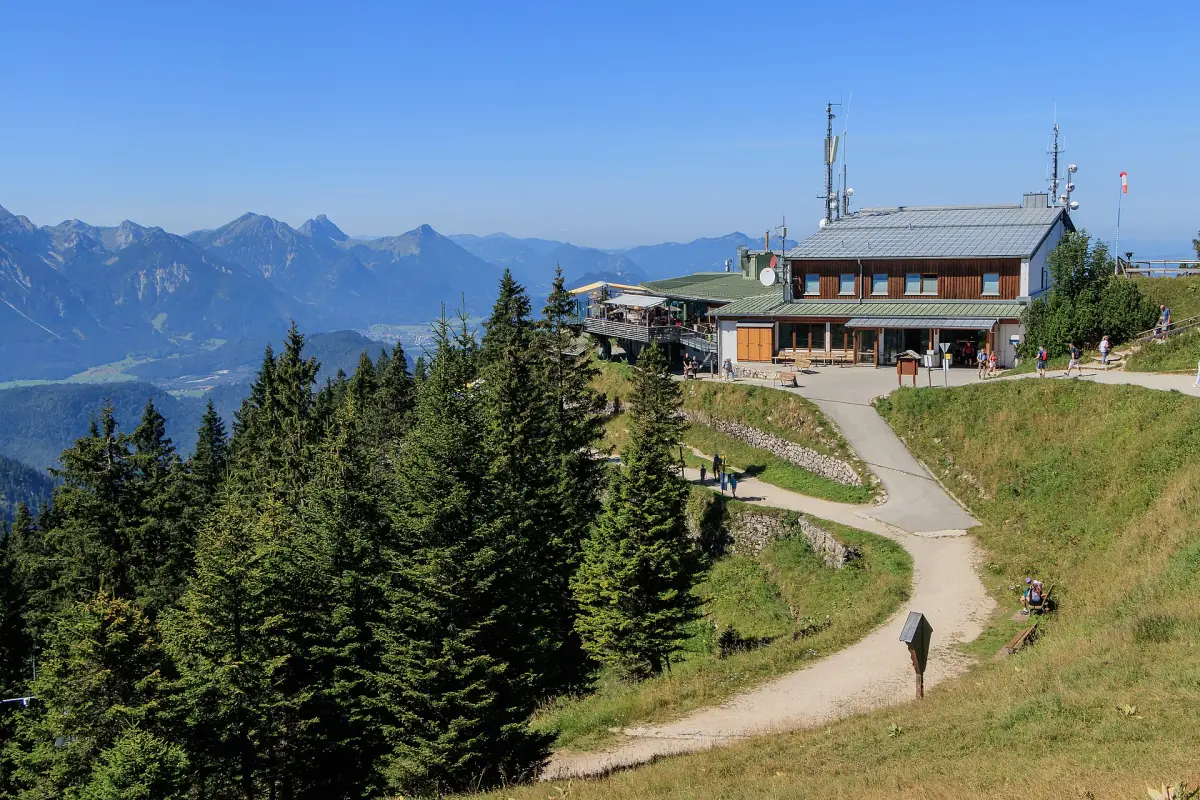 The Tegelberg mountain station with the Alps behind